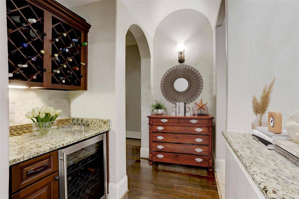 The butler’s pantry is thoughtfully positioned between the formal dining room and kitchen, offering both convenience and functionality. Perfect for entertaining, this space provides additional storage and prep area, making it easy to serve meals and keep essentials within reach. Whether you're hosting a formal dinner or a casual gathering, the butler’s pantry enhances the home’s flow.