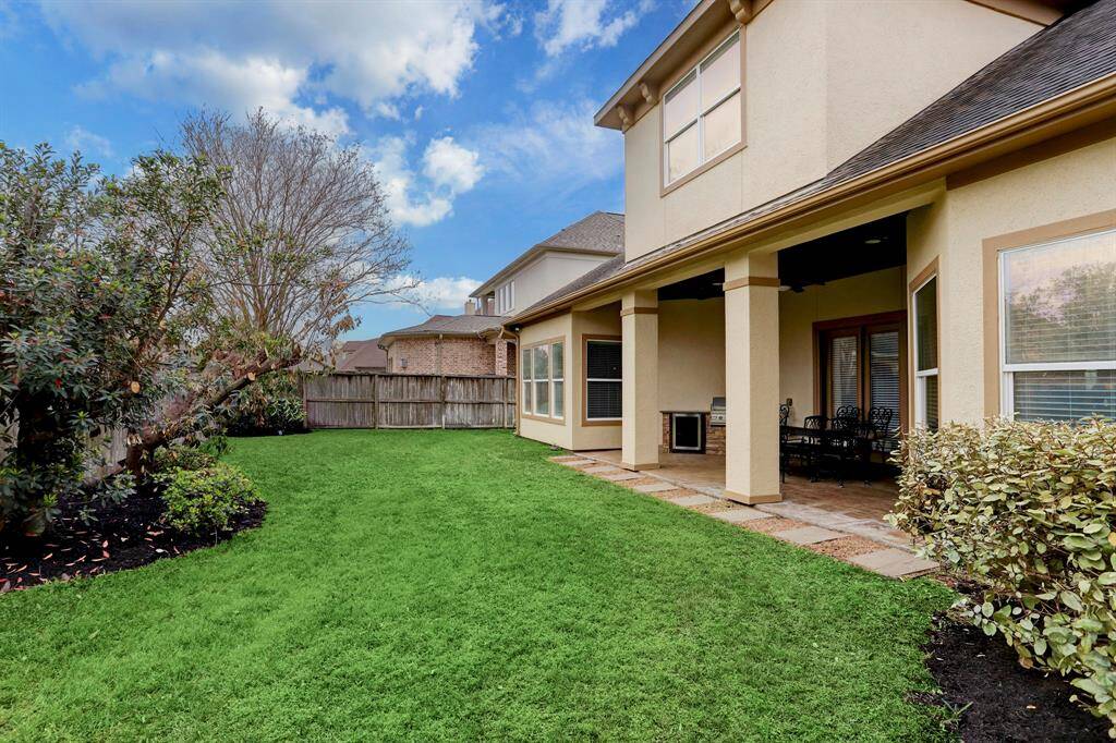 Situated on a spacious lot, this home offers abundant yard space both in the front and back, complemented by lush landscaping and meticulous upkeep. The expansive outdoor area provides endless possibilities for recreation, gardening, or future customizations.