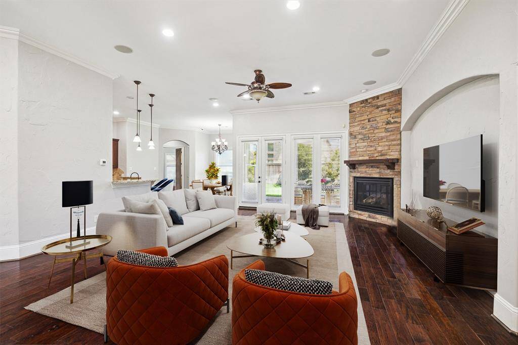 Step into this expansive living area, designed to be the heart of the home—perfect for entertaining family and friends. With its open-concept layout, soaring ceilings, and abundant natural light, this space creates a warm and inviting atmosphere. (Digitally Staged)