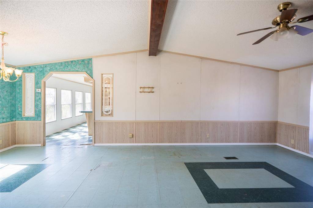 Large open Family room with beautiful arched walkway to kitchen.