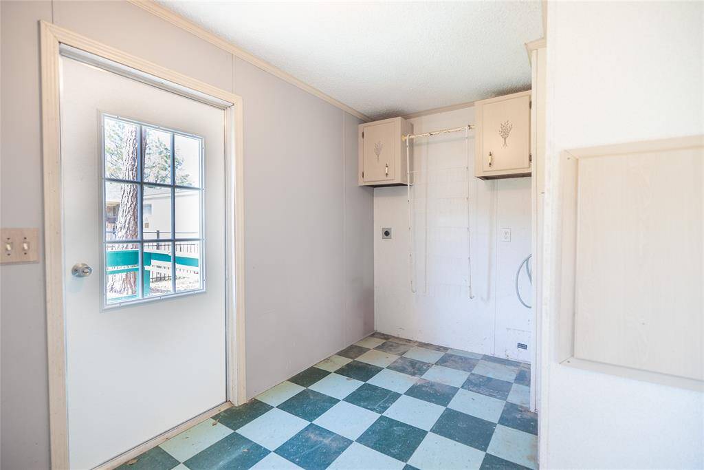New side door and large laundry room.