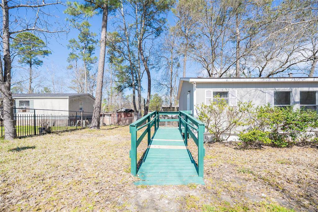 Ramp with new boards leading to back door entrance.