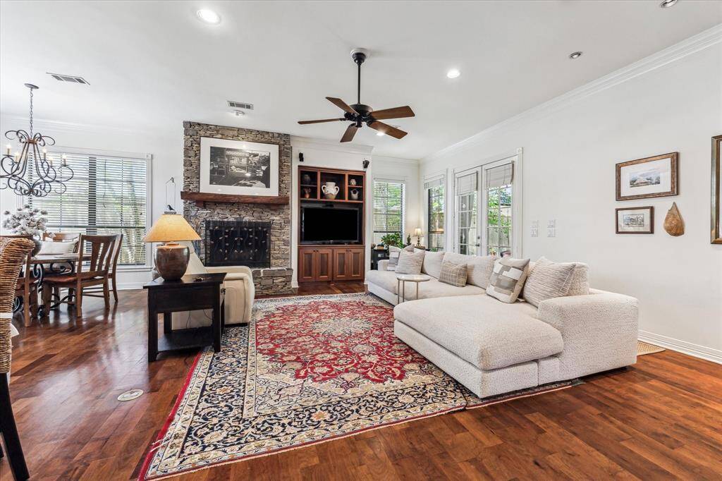 The great room's ceiling is 10' along with the stone wood burning fireplace.  Their are built-in cabinets to house your electronics.