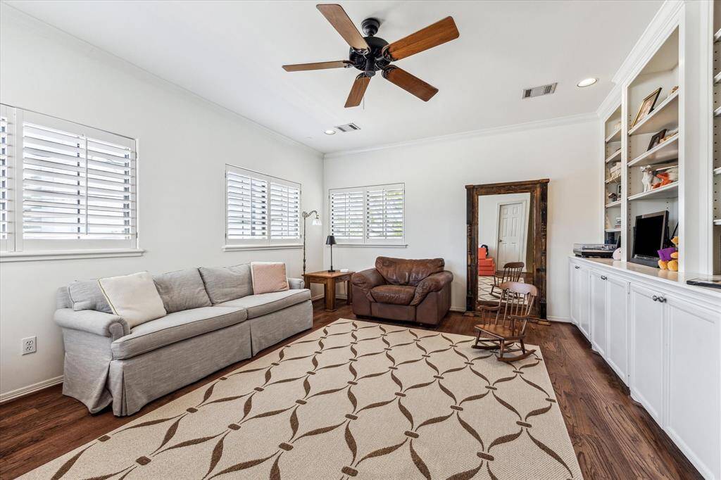 The 2nd floor game room features built-in cabinetry and loads of storage for games, toys and linens.