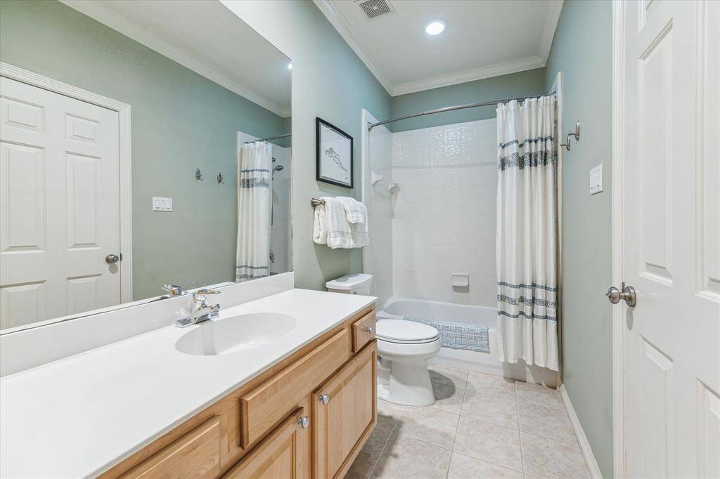 This ensuite bathroom has a nice sized vanity, new toilet and ample storage.