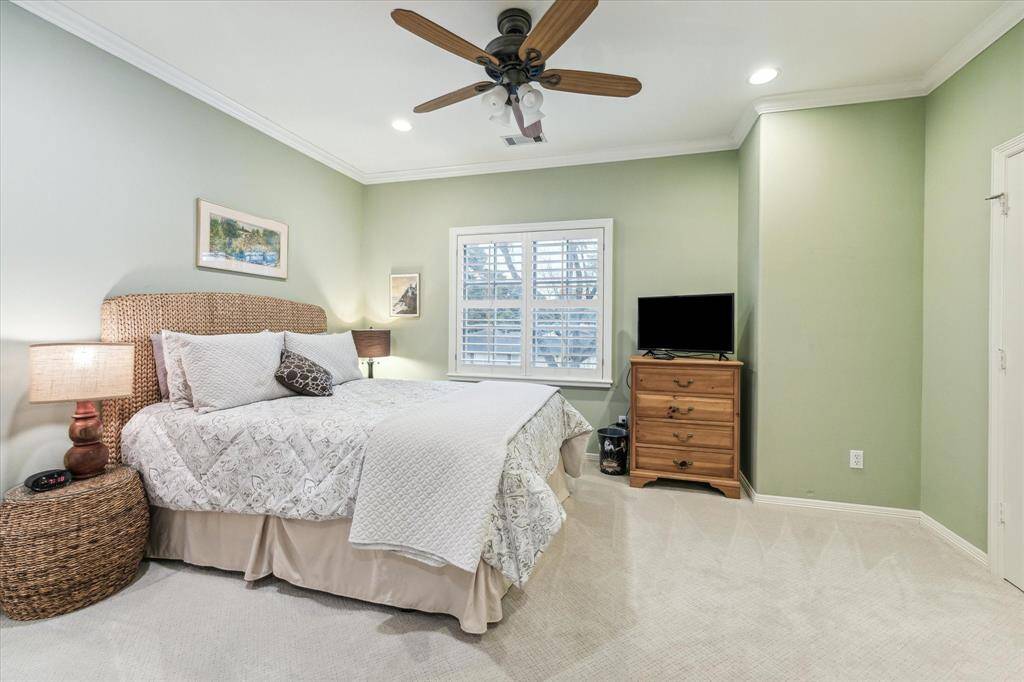 This bedroom also has beautiful views of the neighborhood, especially at night.