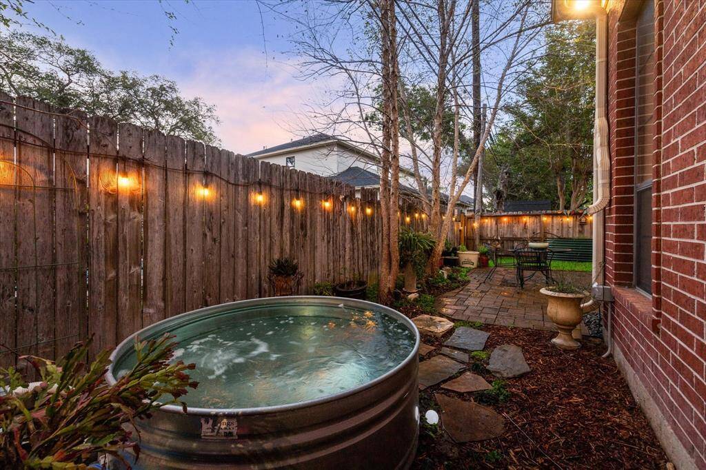 This is a cozy backyard is the perfect retreat for busy professionals that want low maintenance.  There is a privacy fence, mature trees, offering an inviting outdoor retreat.