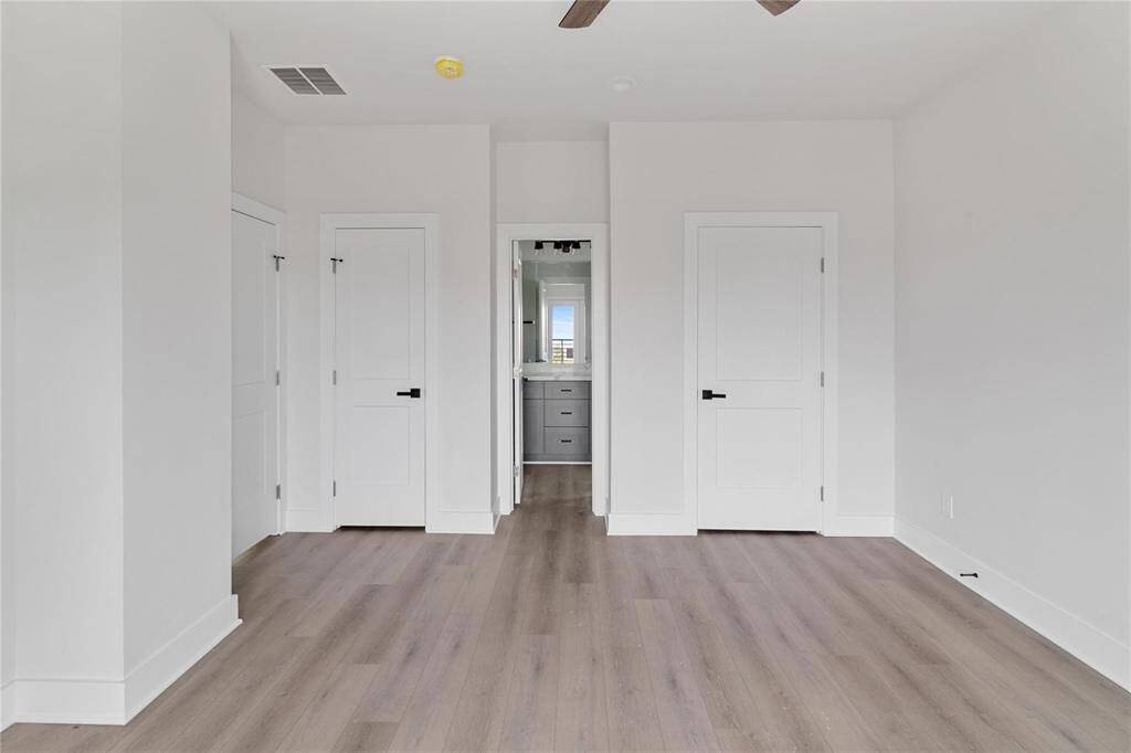 Primary bedroom is a blank canvas has ample natural sunlight for you to decorate as your own!