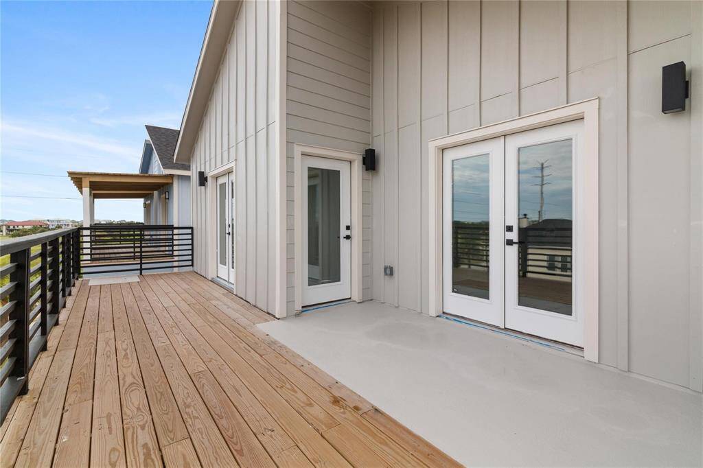 Wake up or wind down in this extended deck right outside of the Primary bedroom.