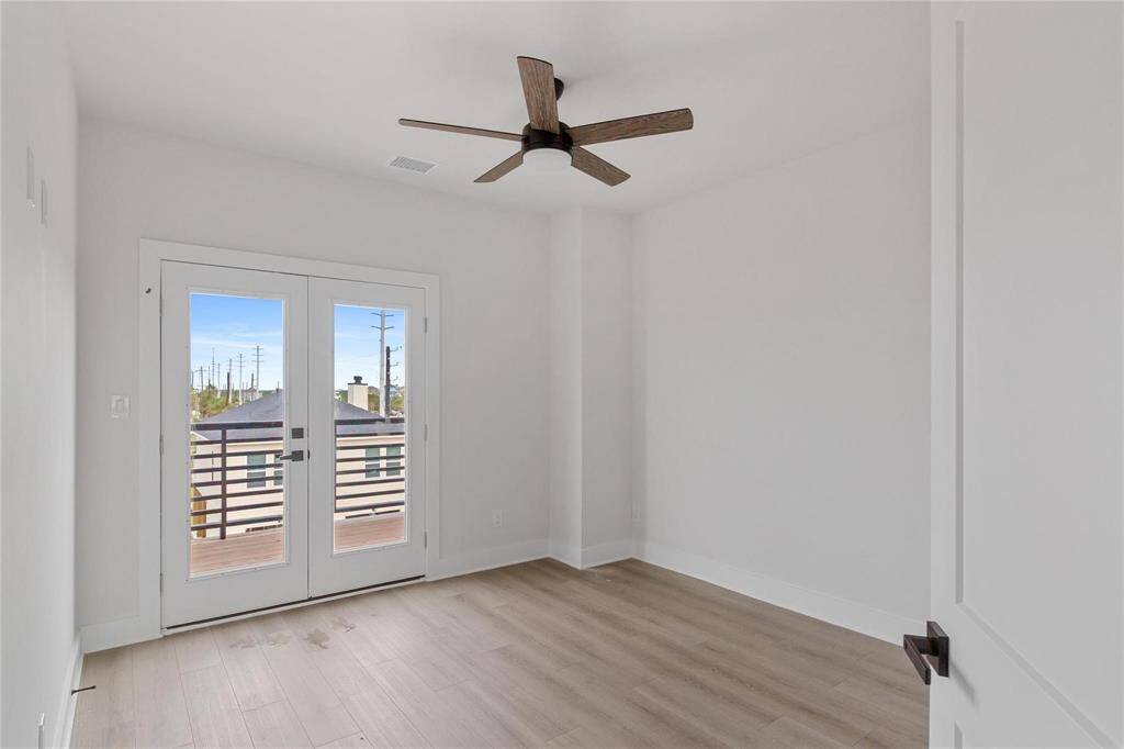 Secondary bedroom on the second floor with a ceiling fan and neutral walls ready for your personalization.
