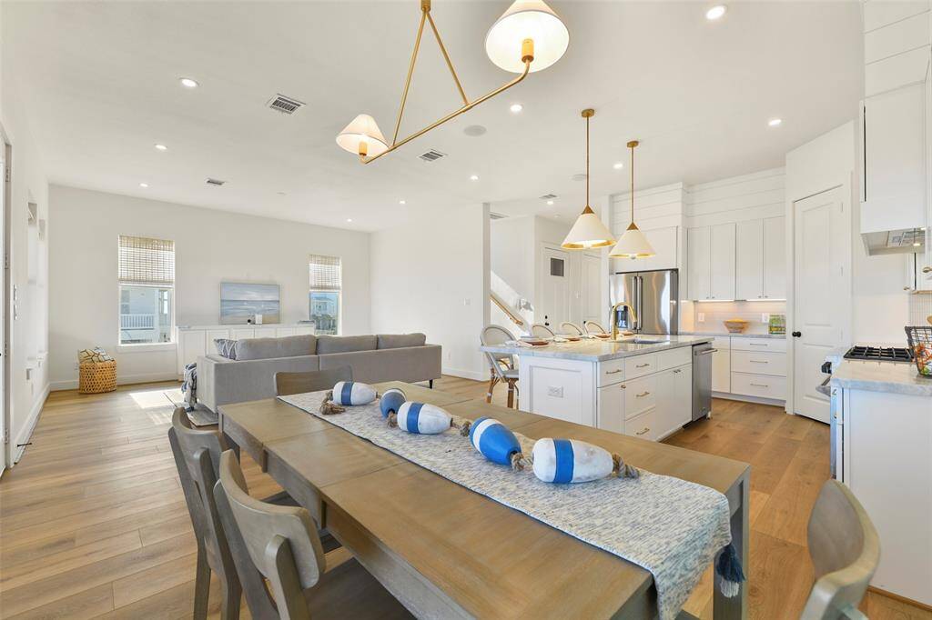 The main level boasts an open-concept design, seamlessly connecting the living, kitchen, and dining areas. Perfect for daily living and hosting gatherings of any size, this home is built for entertaining!  And of course those VIEWS!