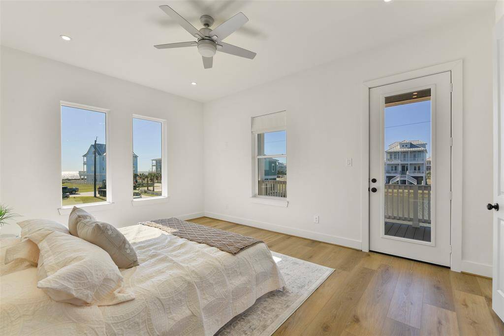 Wake up to stunning water views from the main floor primary bedroom, where you can enjoy the scenery from the comfort of your bed or step out onto your own private front deck.