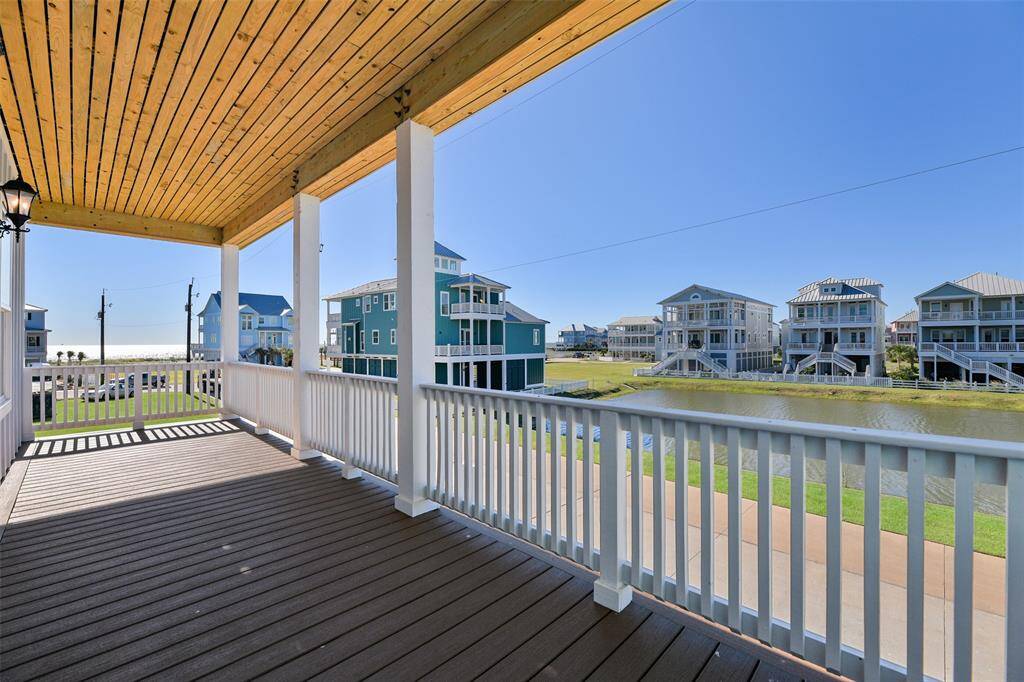 The main floor front deck is a true retreat off the primary bedroom- featuring elegant beauty banding and durable all-weather decking. Enjoy panoramic Gulf and pond views, perfect for relaxing or entertaining outdoors.