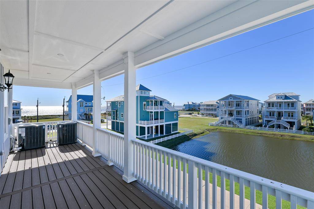 The top floor front deck homes the double-air conditioners to ensure ultimate comfort on hot summer beach days. This deck offers the same stunning Gulf and pond views, enhanced by durable all-weather decking. It’s the perfect elevated spot to take in the beauty of your surroundings.
