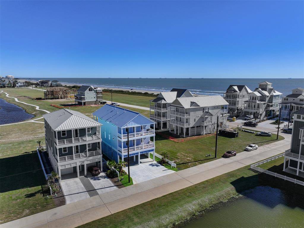 A stunning exterior showcases a brand-new construction, perfectly positioned just a short stroll from the beach shore and the tranquil pond trail—offering the ultimate coastal lifestyle.
