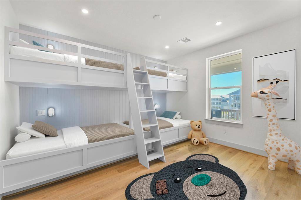 *Virtually staged for illustration purposes only.*This custom-designed 4-bed bunkroom is both stylish and functional, featuring built-in bunks with individual designer lights. Perfectly crafted for comfort and charm, this space is ideal for kids or guests.