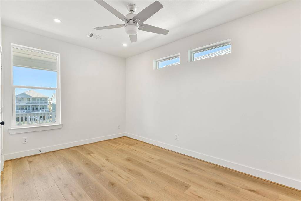 his top-floor bedroom combines comfort and style, featuring its own ensuite with custom designer fixtures and serene water views.