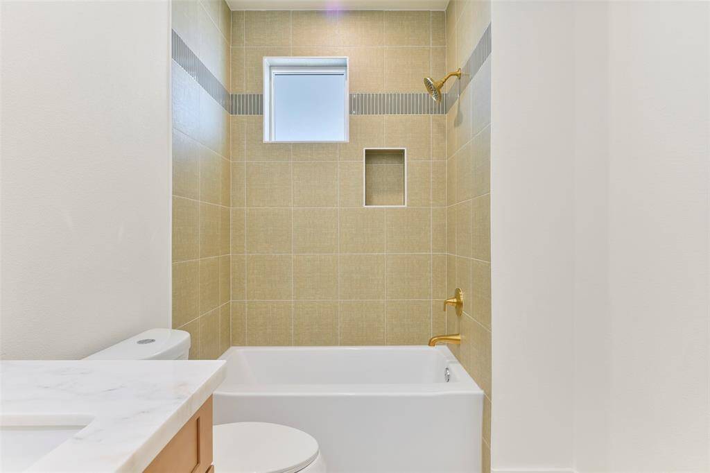 Each ensuite in this home is thoughtfully designed, featuring stylish custom finishes and a luxurious tub/shower combination for ultimate comfort and functionality.