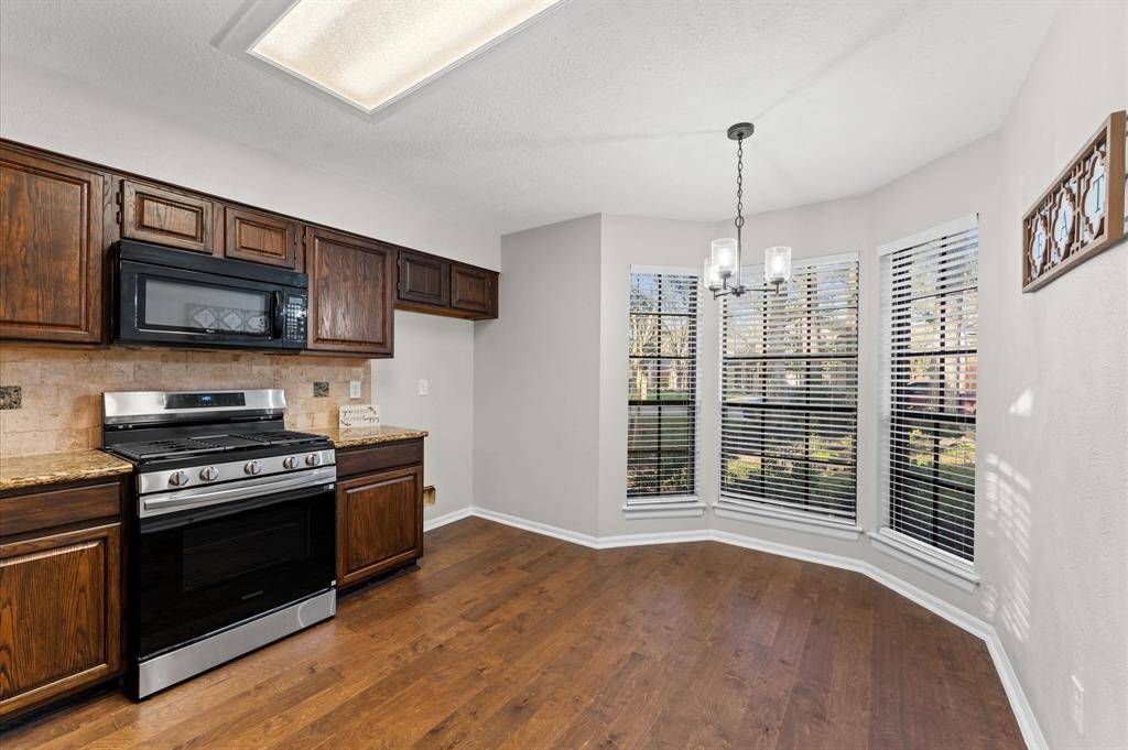 Kitchen has breakfast nook & beautiful bay window