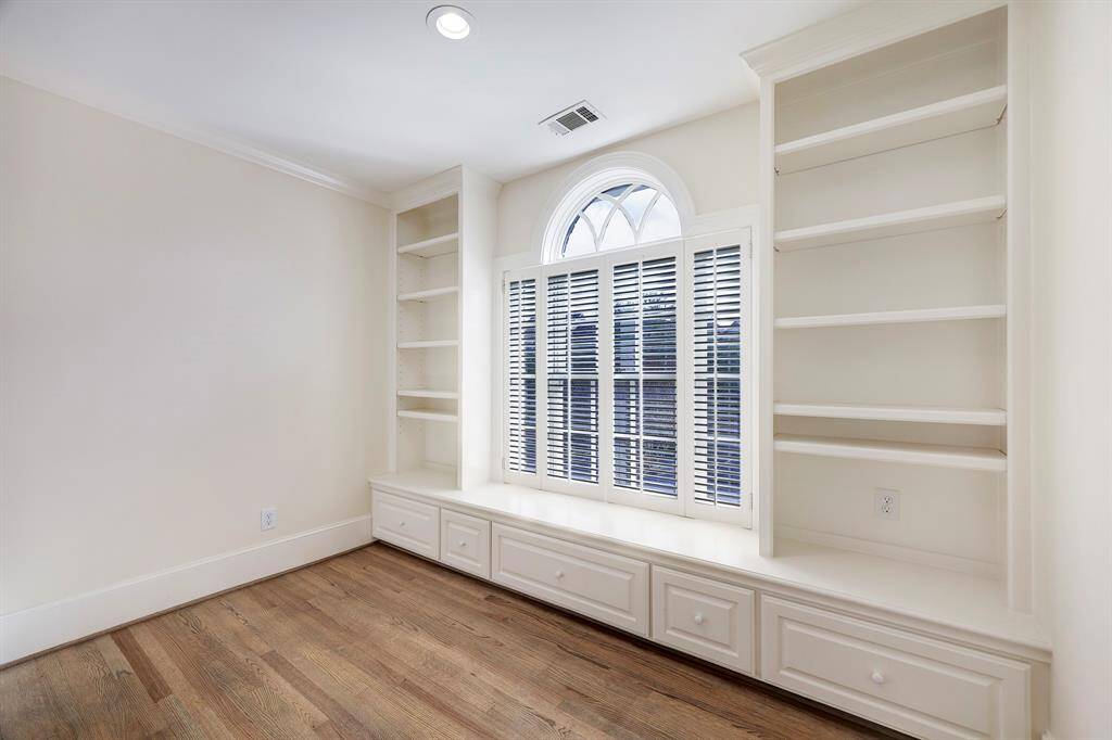 Wall of built ins on second floor landing