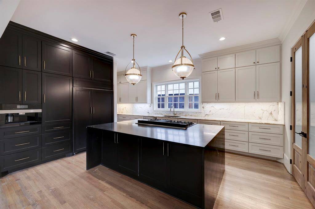 Chefs inspired Kitchen with top of the line appliances. Taken to the studs in 2022 with renovation completed last January. Marble waterfall counters & backsplash, designer lighting, Miele Machine, Z-Line cook top, & so much more.