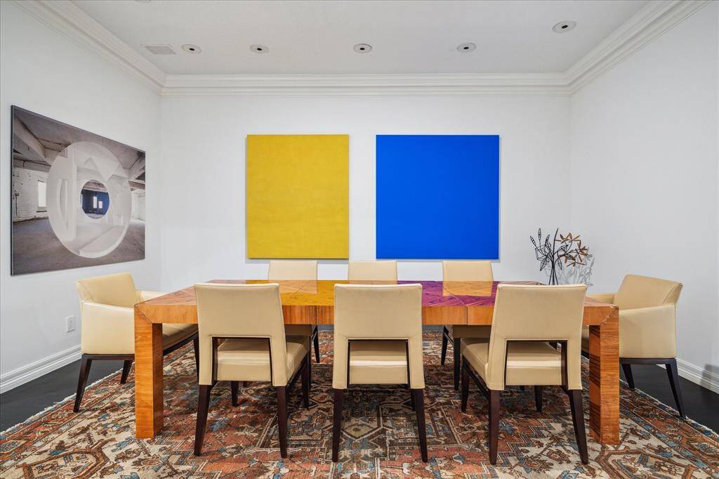 DINING ROOM - A spacious room with cased openings, this dining room is ideal for both everyday meals and special occasions. Its thoughtful layout ensures effortless flow while maintaining a sense of formality.