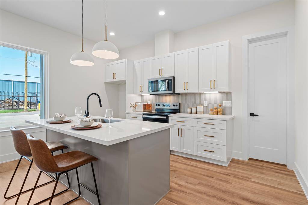 This stunning two-story modern farmhouse duplex offers a perfect blend of charm and contemporary design. With one unit on the first floor and another on the second, each home features a private entrance and thoughtfully designed living spaces. Clean lines, light tones, and warm earth accents create a timeless and inviting curb appeal.