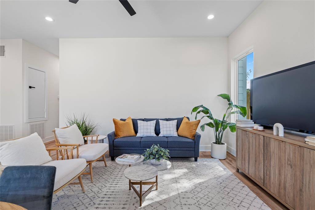 The living area is perfect for both entertaining and unwinding, offering a spacious, inviting environment for any occasion