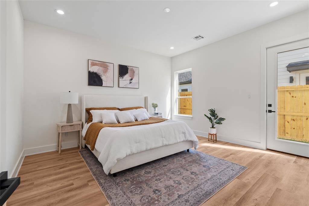 The oversized primary bedroom offers plenty of space for relaxation and personalization. A peaceful retreat with room to spare.