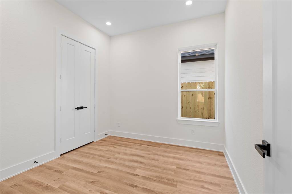 The third secondary bedroom offers a generously sized space, perfect for a guest room, home office, or a growing family