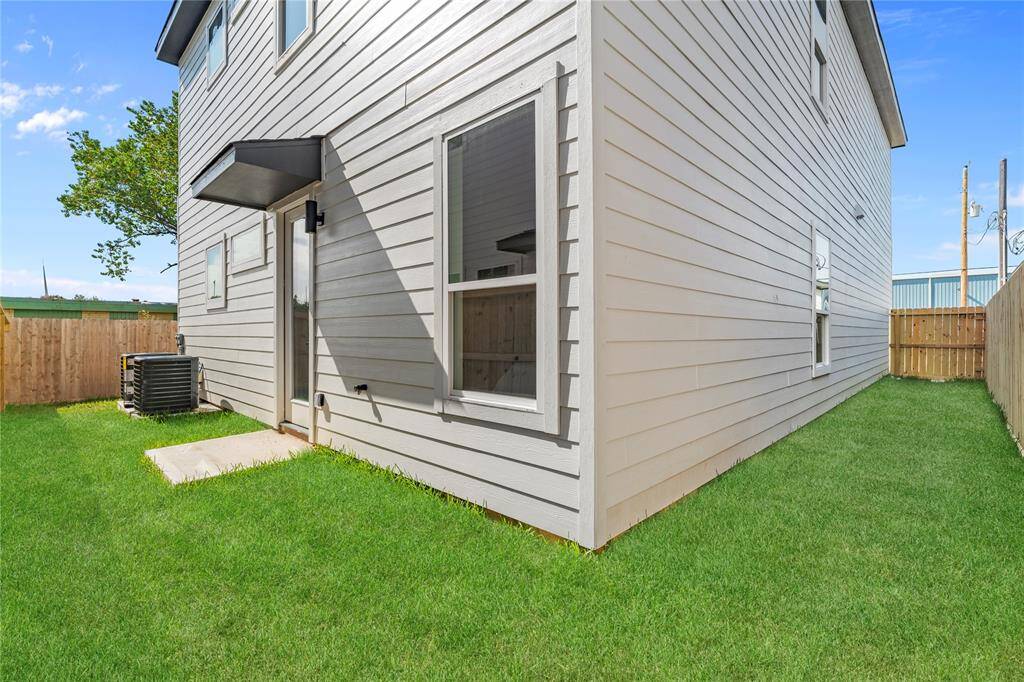 The spacious backyard offers plenty of room for outdoor activities, gardening, or simply relaxing in a private setting.