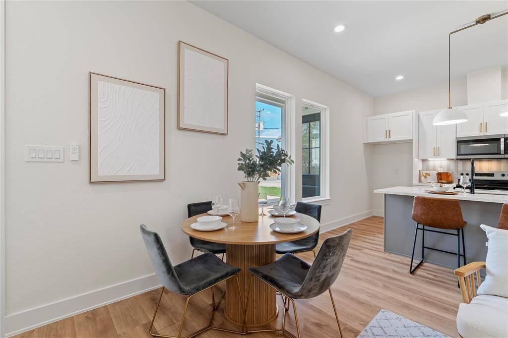 The designated dining area provides a stylish and functional space for gatherings. With an open layout and natural light, it’s the perfect spot to enjoy meals and create lasting memories.