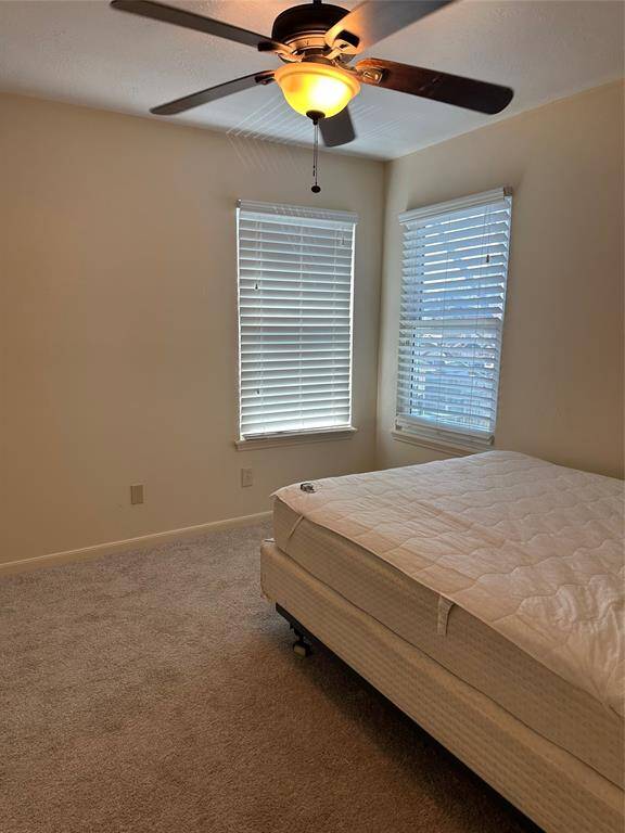 2nd bedroom with ceiling fan. Recently replace carpet