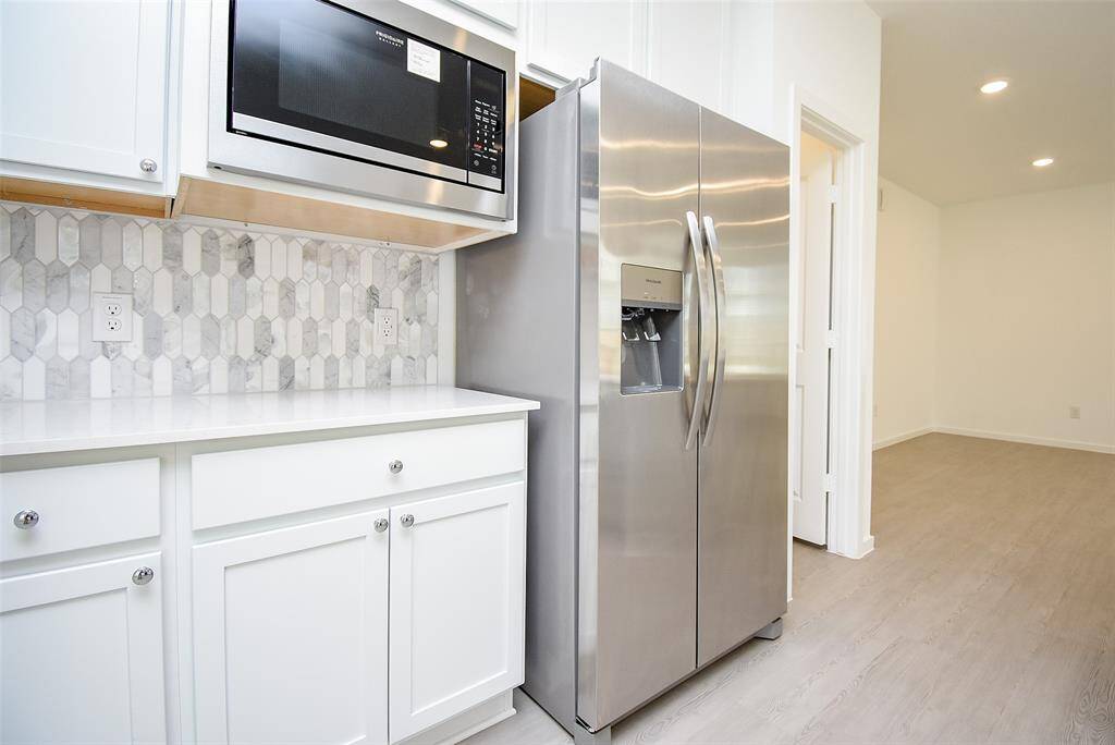 New microwave mounted above gives you more counterspace.  Additional cabinets all around.