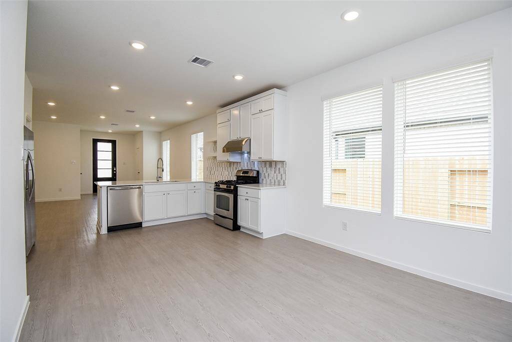 Another view of the dining/kitchen area.  Notice the cabinets at the top.  No space has been wasted.