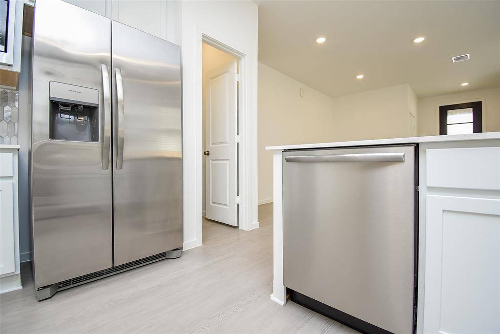 Brand new Frigidaire dishwasher and side by side refrigerator with icemaker and water dispenser.