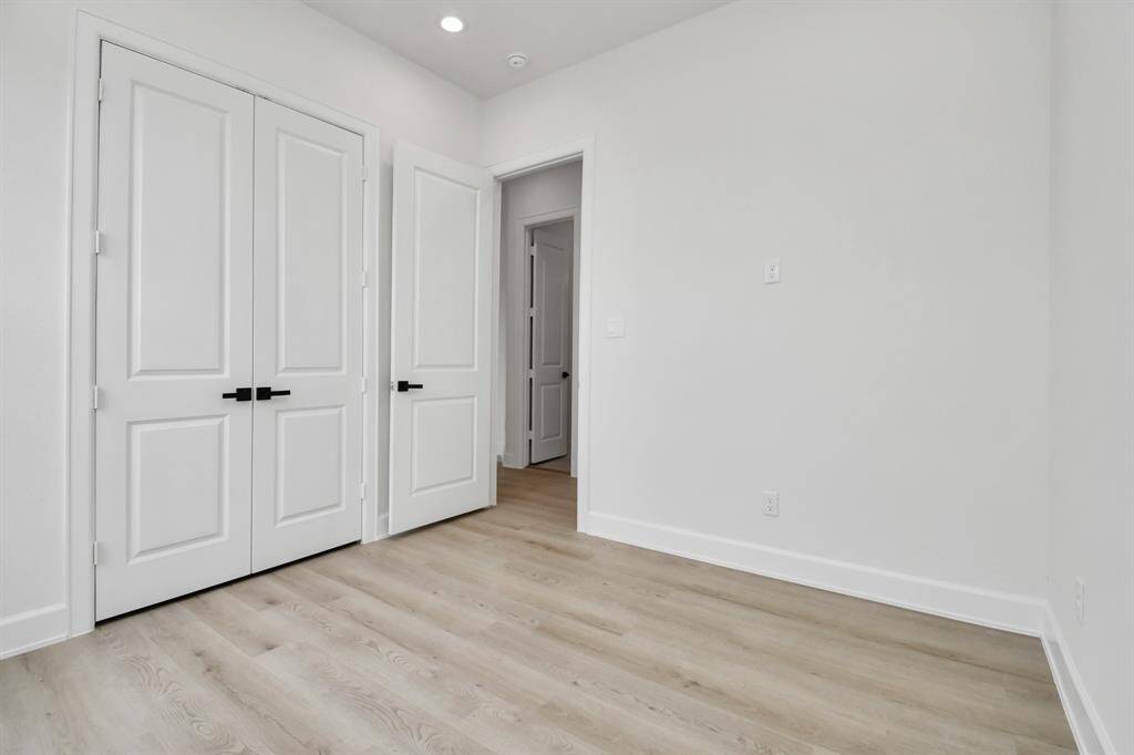 Enjoy comfort in the secondary bedrooms. These thoughtfully designed spaces offer abundant natural light and storage, making them perfect retreats for relaxation and personalization.