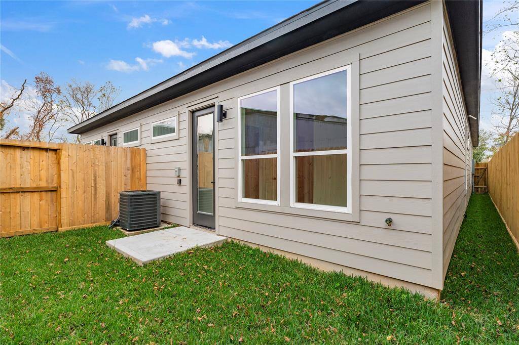 Enjoy the convenience of a fully fenced yard with a private gate, providing security and seclusion for your outdoor living.