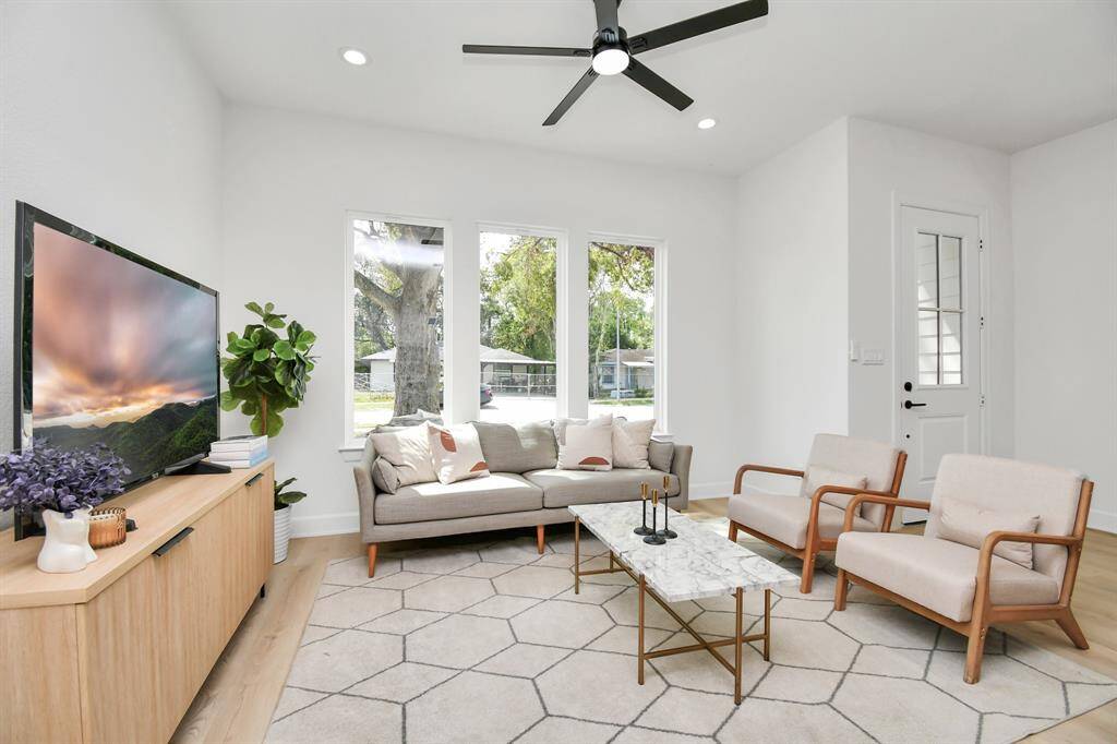 Luxury vinyl flooring flows throughout the home, combining sleek style with durable construction. This modern touch enhances both beauty and practicality in every room.