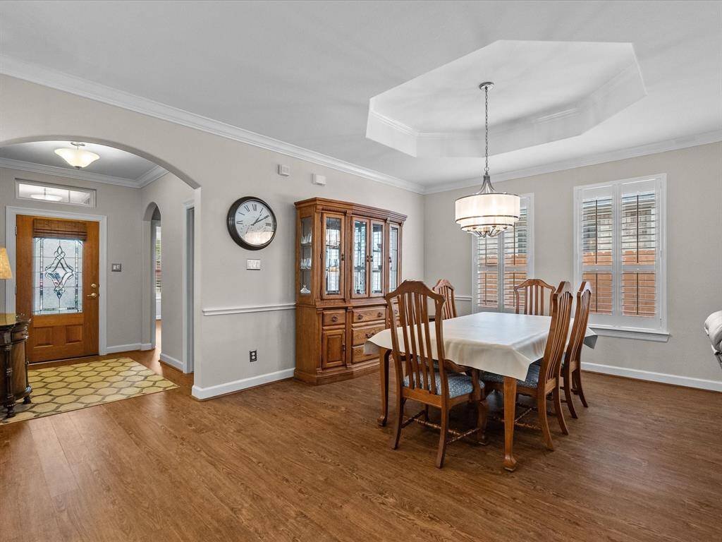 This space offers ample room for dining and entertaining, with easy access to the kitchen and living areas