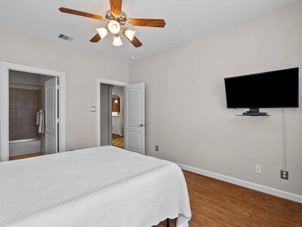 Guest bedroom featuring ensuite full bathroom and large closet!
