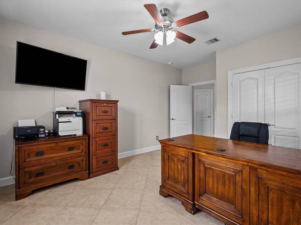 This room offers ample natural light and flexible space to suit various needs.