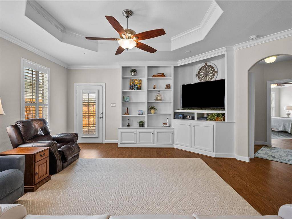 This inviting space offers access to the outdoor patio and seamlessly flows into the dining area