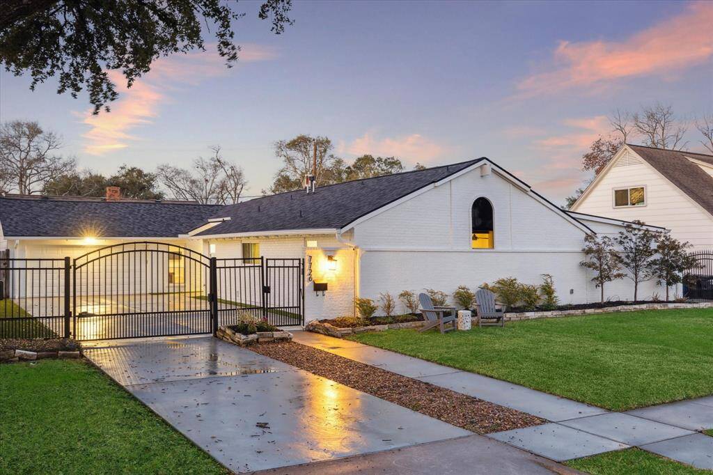 Fantastic Briarmeadow brick home with a driveway gate, landscaped front yard, and great location on a quiet street.