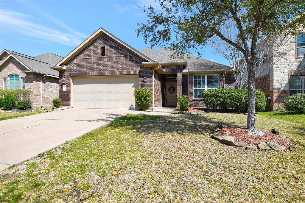 Charming single-story brick home with a two-car garage and manicured front yard. Features a welcoming entryway, mature trees, and well-maintained landscaping. Ideal for buyers seeking a cozy suburban setting.