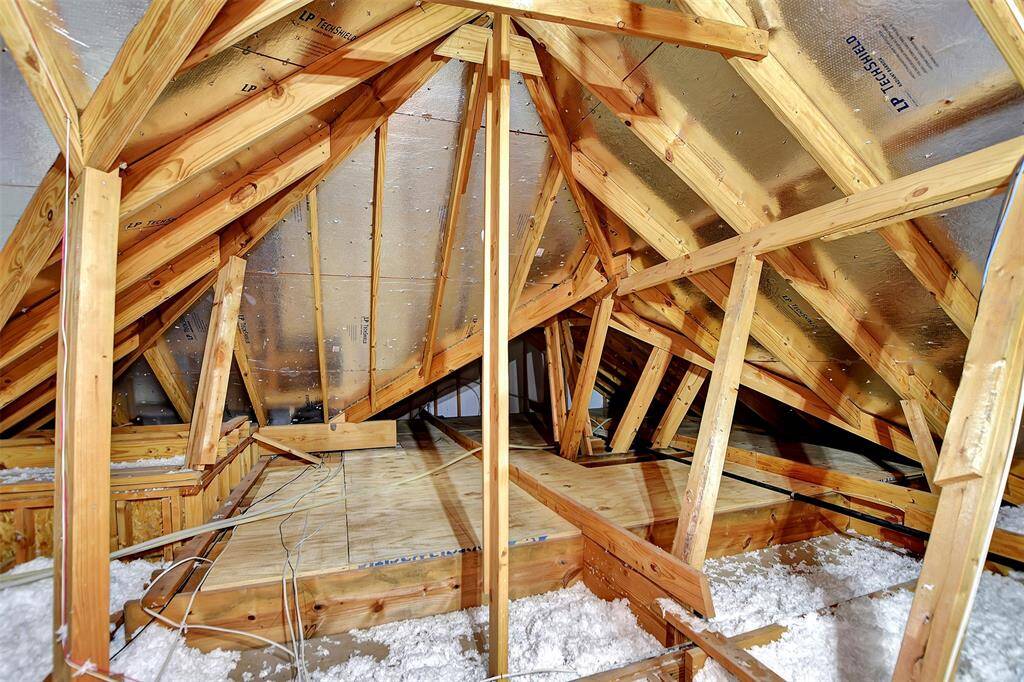 The attic has some flooring for extra storage. It is also insulated with TechShield Radiant Barrier.