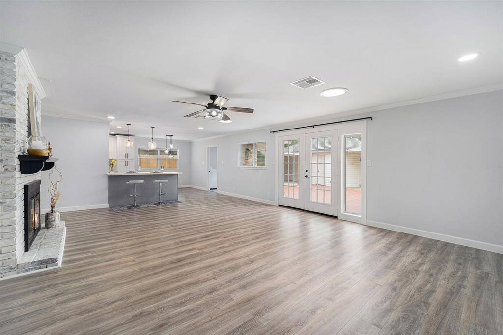 French doors lead to an outdoor patio, enhancing indoor-outdoor living.