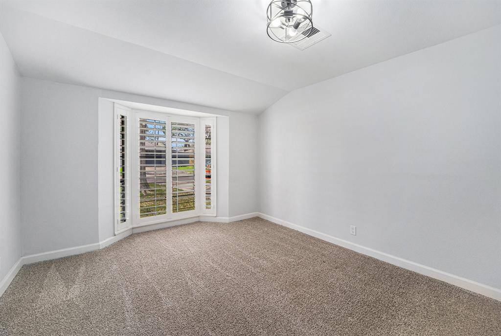 The room at the front of the home can be used as either a 4th bedroom or a closed-door office.