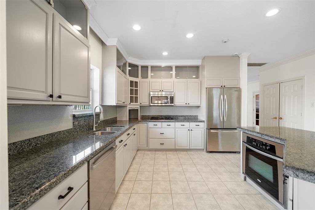 Any chef's dream, this stunning kitchen is perfect for everyday life as well as entertaining family and friends. The kitchen island is perfect for conversation or that much needed space to lay out your party spread for everyone to enjoy!