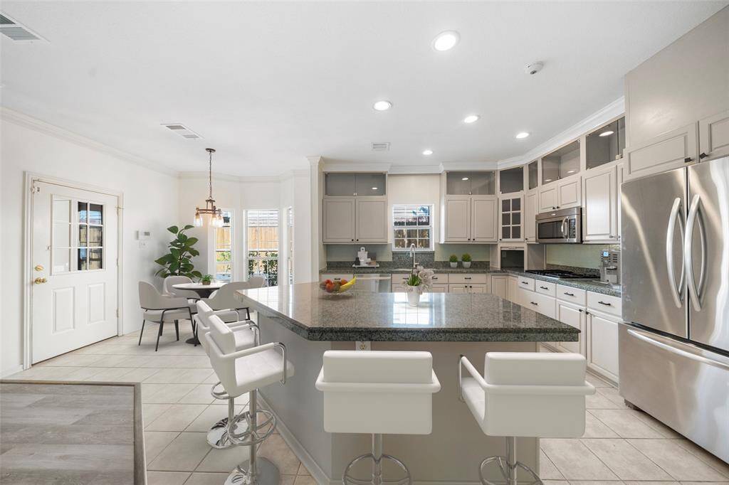 This stunning kitchen displays such a beautiful contrast with the BRAND NEW lightly stained cabinets and granite countertops. *virtually staged*